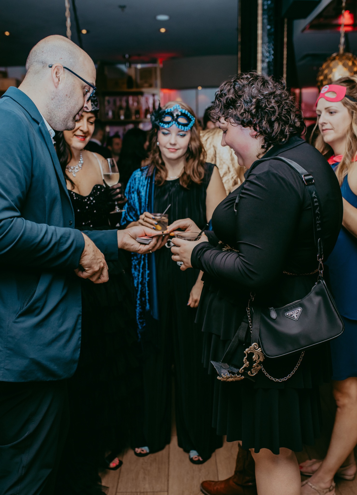 Michael Bourada performing mingling magic for guests at a corporate event