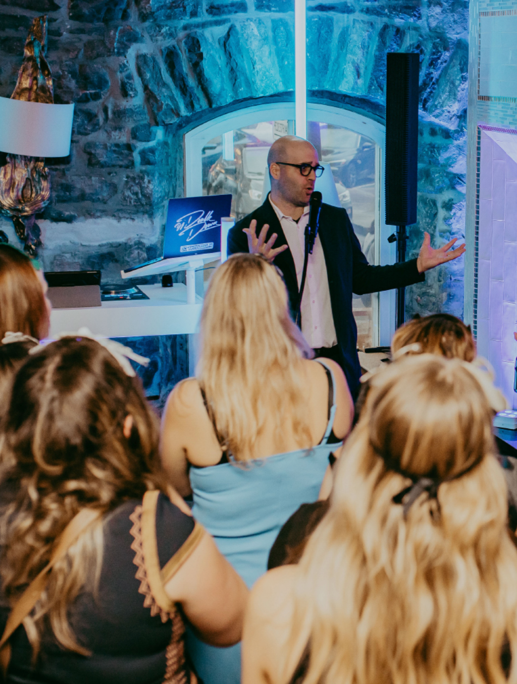 Michael Bourada performing a feature magic show for a private audience